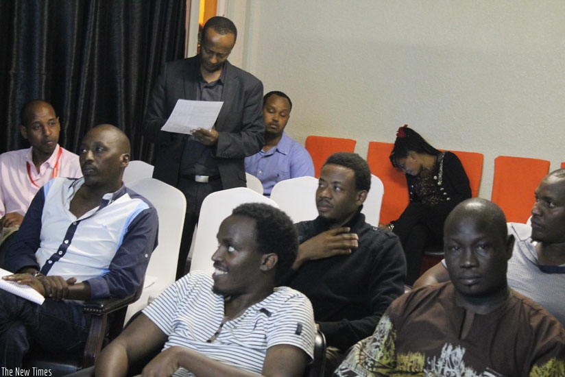 Students from the Kwetu Film Institute follow one of the screenings. Standing at the back is Eric Kabera. (Moses Opobo)