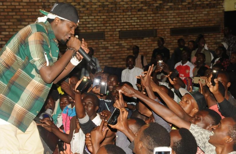The excited fans dance and scream as Riderman performs. (Julius Bizimungu)
