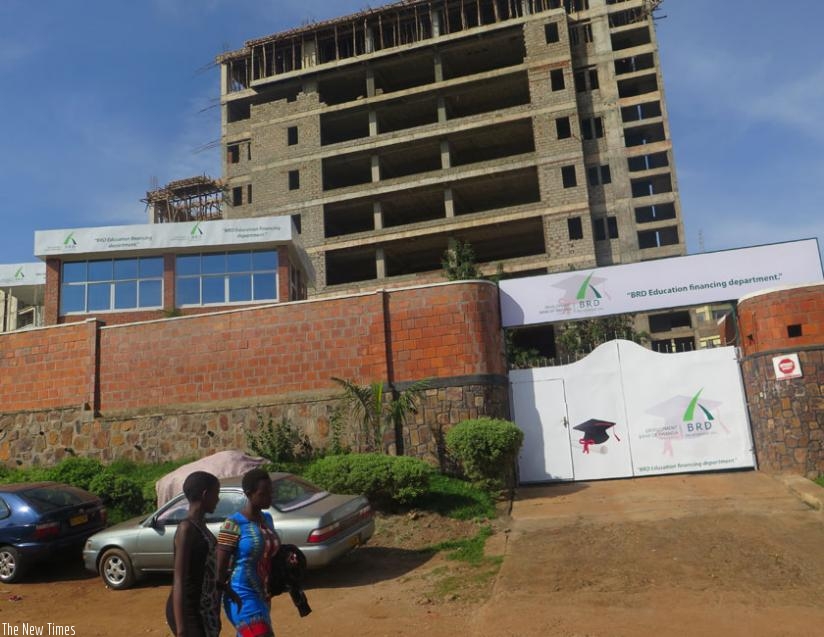 Women pass by BRD's new office in Kacyiru that will handle student loan scheme. (Solomon Asaba)