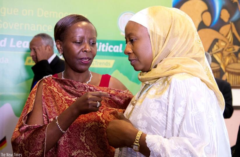 Foreign Affairs minister Louise Mushikiwabo (L) chats with the African Union Commissioner for Political Affairs, Dr Aisha Abdullahi, after the opening session of the fourth African Union High-Level Dialogue on Democracy, Human Rights, and Governance in Kigali yesterday. (Timothy Kisambira)