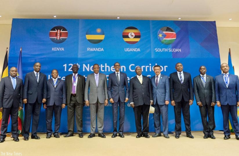 President Kagame (C), Uhuru Kenyatta of Kenya and Yoweri Museveni of Uganda pose for a group photo with senior officials at the twelfth Northern Corridor Integration Projects Summit in Kigali yesterday. (Village Urugwiro)