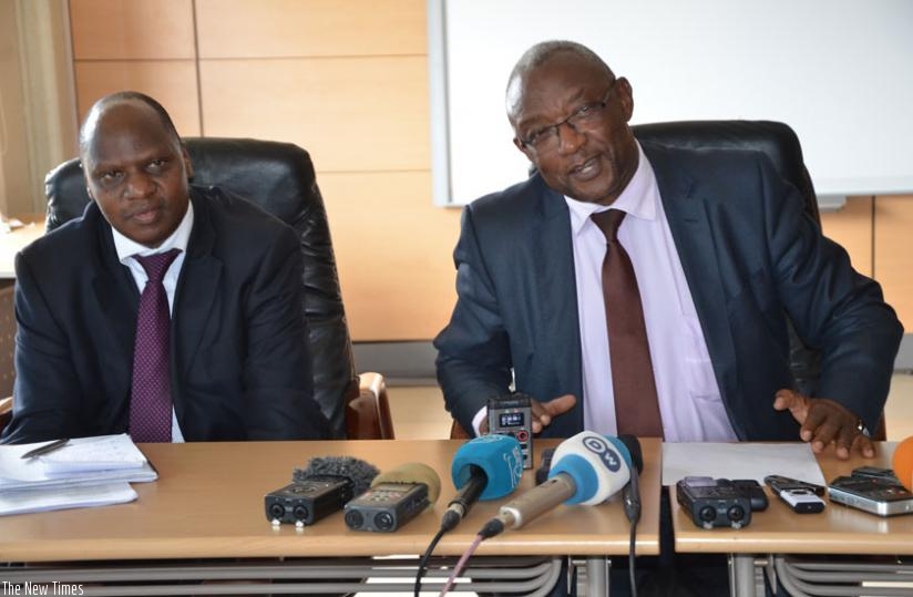 Prof. Mbanda (R) and Munyaneza brief journalists on NEC's preparations ahead of the referendum scheduled for next week. (Sam Ngendahimana)