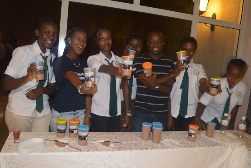 A group of Gashora Girls students, who attended the Christmas tree lighting ceremony, pose with their products. 