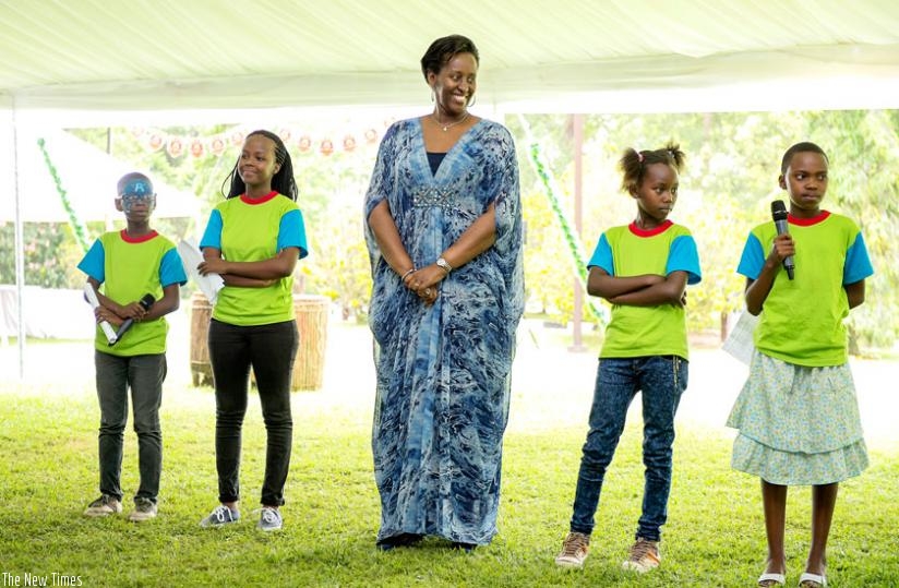 First Lady Jeannette Kagame smiles as she listens to a young participant during a conversation session at the holiday children's party at Village Urugwiro yesterday. (Village Urugwiro)