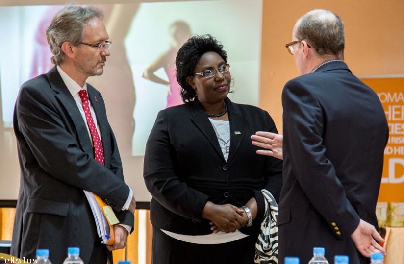 (L-R) Maerien and Mukantabana listen to Ted Maly UNICEF country director at the launch of The State of the World Population 2015 report yesterday in Kigali. (Doreen Umutesi)