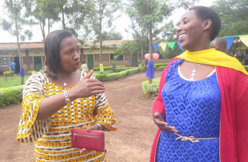 Eastern Province Governor Odette Uwamariya (L) and MP Umutesi Anita chat after casting their votes. (Stephen Rwembeho)