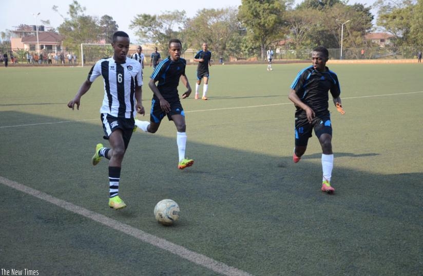 APR midfielder Yannick Mukunzi tries to get past Police defender Jean Marie Muvandimwe during a past league match. Top-flight clubs will get their sponsorship package according to their league positions. (Sam Ngendahimana)