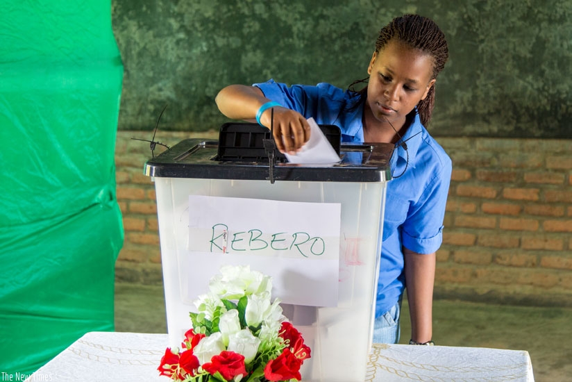 An 18-year-old resident of Rebero Village votes for the first time at Remera Catholic Primary School polling station. (Doreen Umutesi)