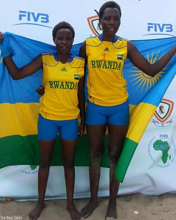 Mukantambara (right) and her national teammate Lea Uwimbabazi pose after Rwanda won the Youth Beach Volleyball Championships in 2014 in Ghana. (File)