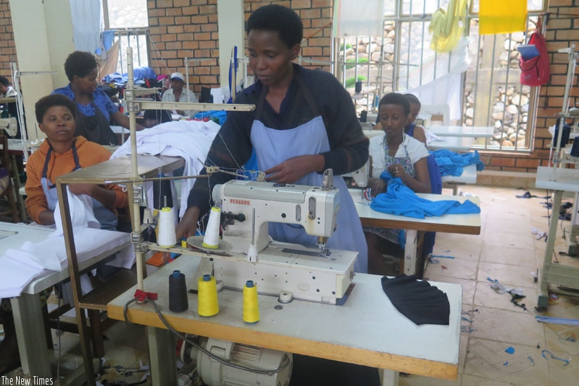 Girls learning tailoring. Short courses can be in any field such as tailoring which students can take on during the holiday. (Solomon Asaba)