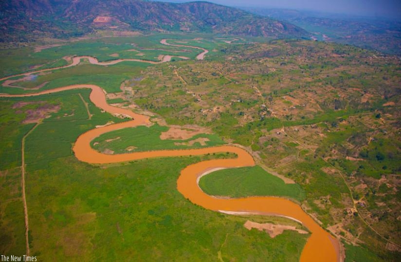 An aerial view of River Nyabarongo, with the water looking muddy brown due to pollution. (Timothy Kisambira)