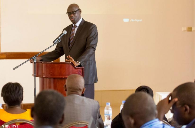 Minister Busingye  speaks at a past event in Kigali. (T. Kisambira)
