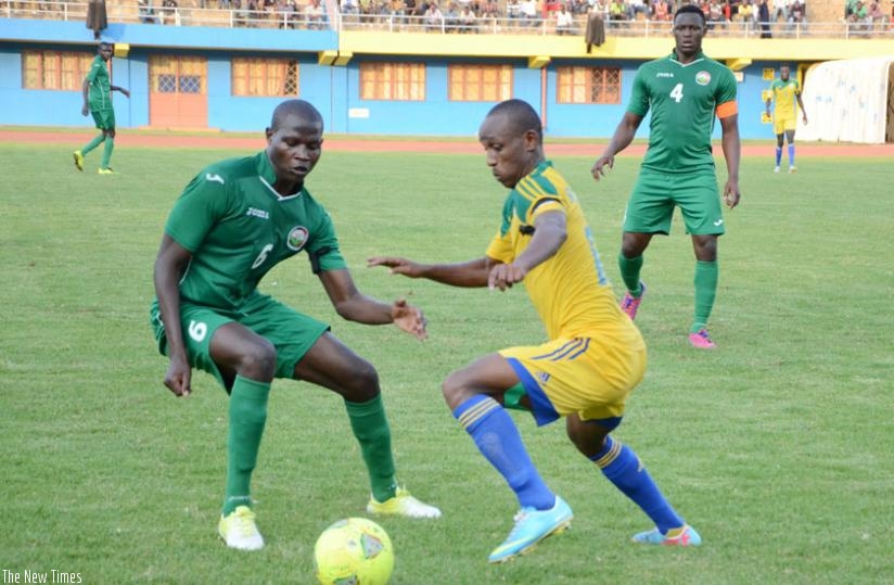 Amavubi winger Claude Iranzi tries to get past a Kenyan defender in a past friendly. Amavubi players start residential camp on Monday ahead of the CHAN competition. (Sam Ngendahimana)