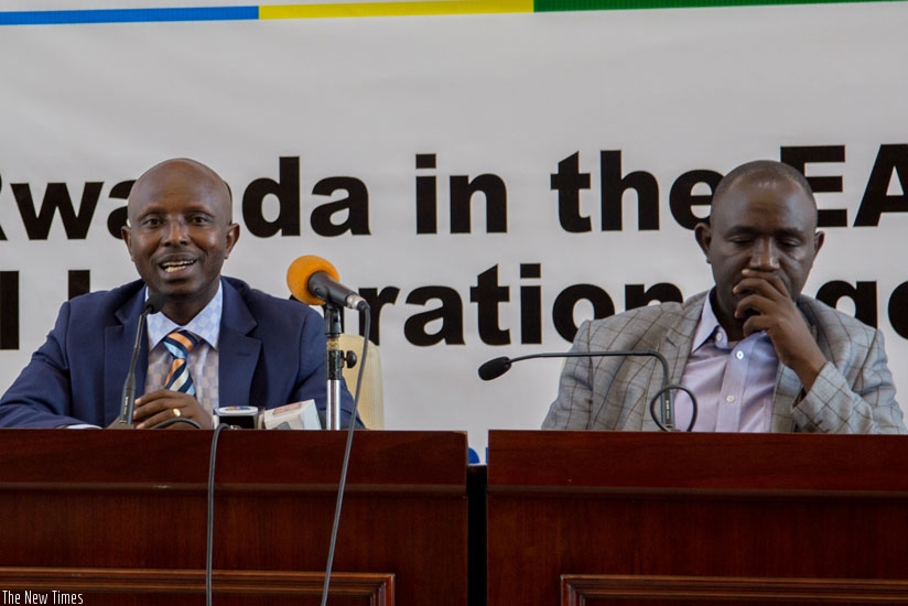 Innocent Safari (L), Permanent Secretary in the Ministry of East African Community, and Nathan Gashaija, the coordinator of EAC Affairs, at MINEAC during a press conference last month. Safari said Rwanda does not owe money to the EAC. (Doreen Umutesi)