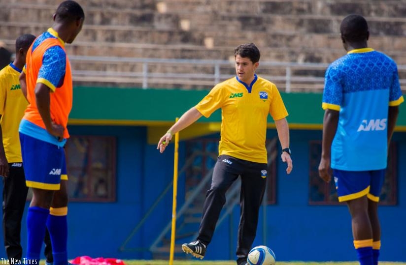 Amavubi coach Johnny Mckinstry takes players through training drills. Amavubi are currently on break and resume training on Monday. (T. Kisambira)