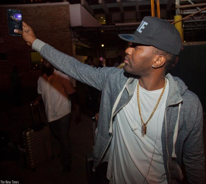 Garfield Spence aka Konshens takes a selfie on his arrival at Kigali International Airport yesterday. The Jamaican Dancehall artist will perform at Amahoro Stadium on Friday. (Faustin Niyigena)