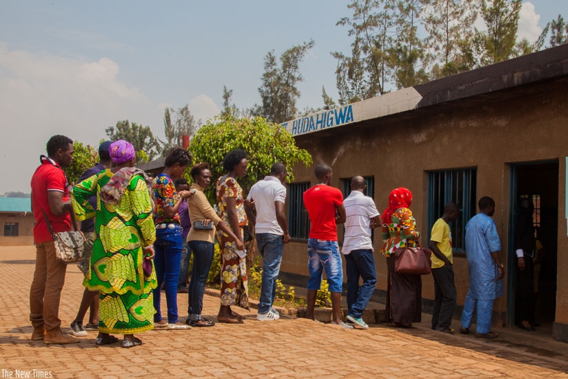 Voters line up at Ntwari polling station to vote in the recently concluded referendum. Elections dominated headlines in Rwanda and Tanzania last year and will dominate the region in 2016 with Uganda going to the polls in February and election fever gripping Kenya ahead of presidential elections next year. (Faustin Niyigena)
