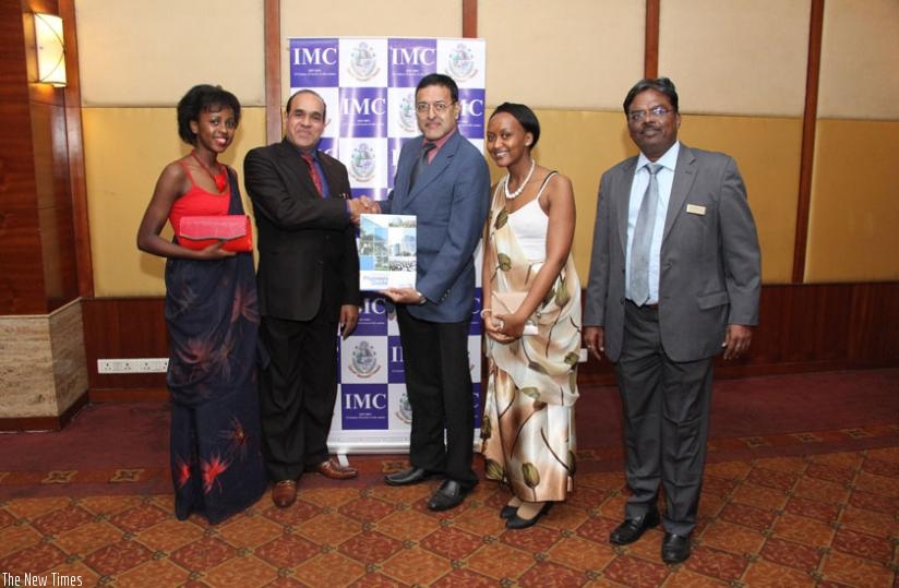 Left to Right: Emma Umutoniwabo, Jain, Fernandes, Annick Ingabire, and Ganeshan Pillai, the IMC joint director, pose for a picture at the release of Rwanda's Meetings Planners Guide 2016 in Mumbai, India recently. (Courtesy)