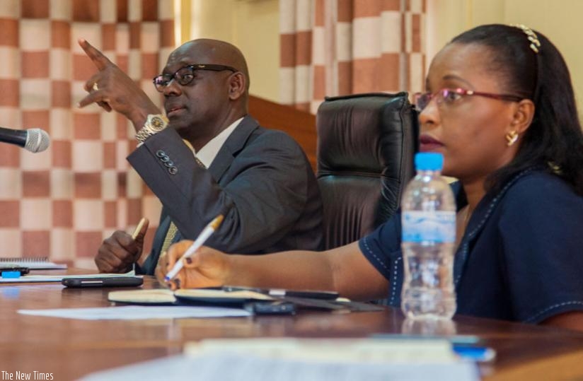 Justice minister Johnston Busingye (L) and the Permanent Secretary at the ministry, Isabelle Kalihangabo, brief journalists on the new system of integrated electronic management of court cases in Kigali last week. (Faustin Niyigena)