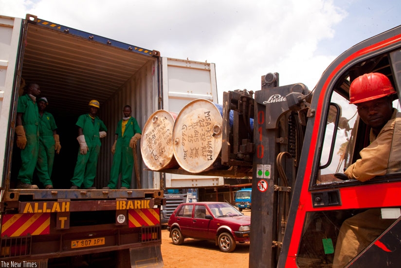 Workers at Mineral Supply Africa Company Ltd load containers of minerals on to trucks. The shipping firm has had to shift from Dar port over mysterious theft of coltan minerals destined for export. (File)