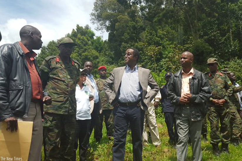 Minister Biruta (left centre) and Lt. Gen Ibingira (right centre) during the tour of Lake Karago in Western province on Tuesday. (Michel Nkurunziza)