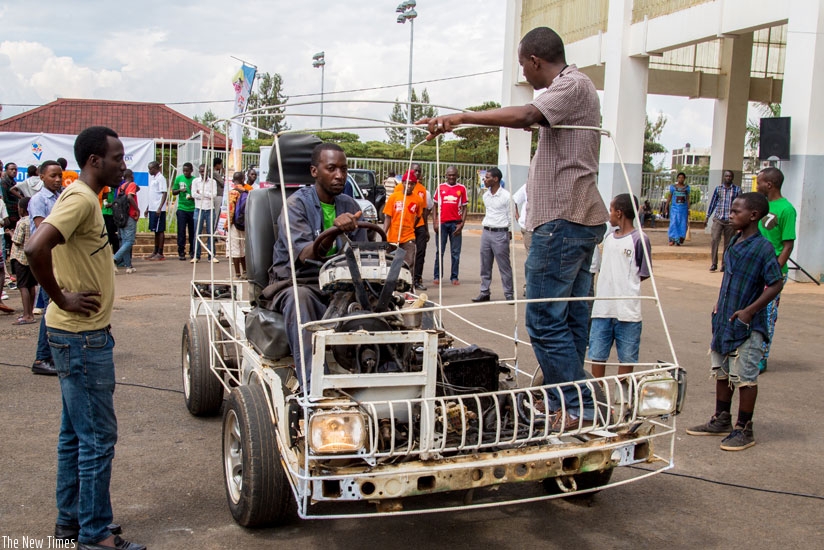 Eric Hakizimana, a teacher at EMVTC, a vocational school in Remera, showcases a prototype car that was assembled by his students. (File)