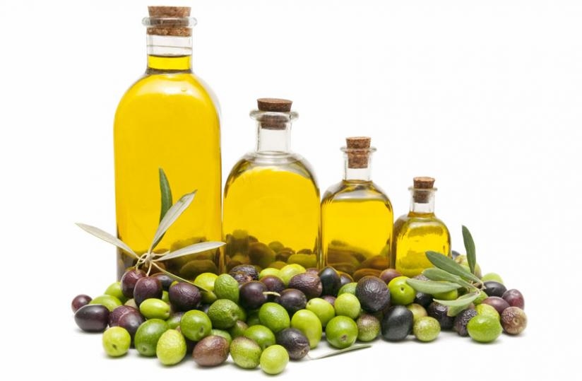 Bottle containing olive oil and olives where the oil is extracted from. (Net photo)