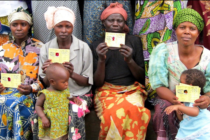 Mothers pose with their health insurance cards at a health centre in Kicukiro District. (File)