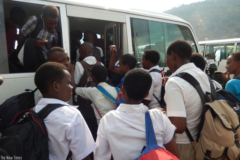 Students struggle to enter a bus after classes. With a sudden change of schools, such disruptions may be greater. (Solomon Asaba)