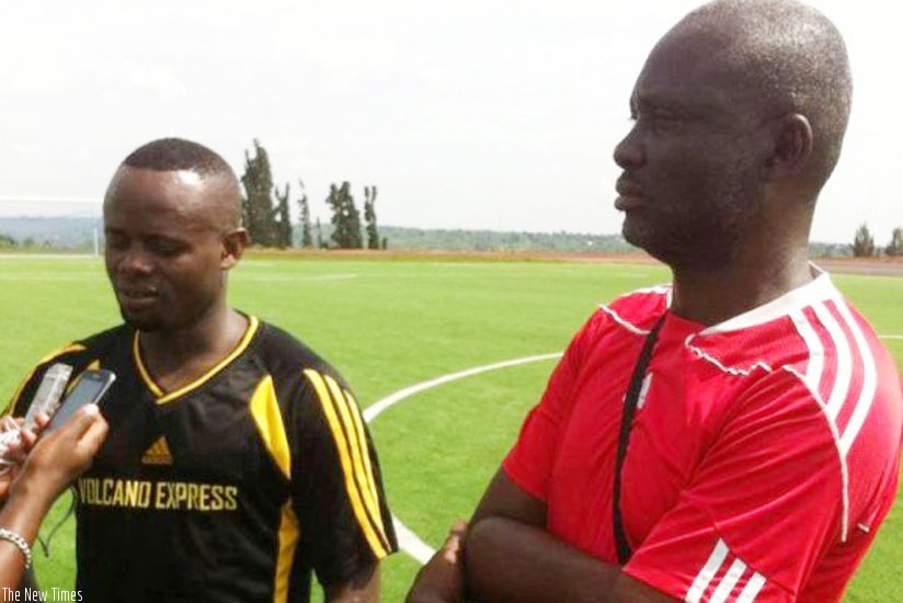 Ngama with Mukura VS head coach Godfrey Okoko.