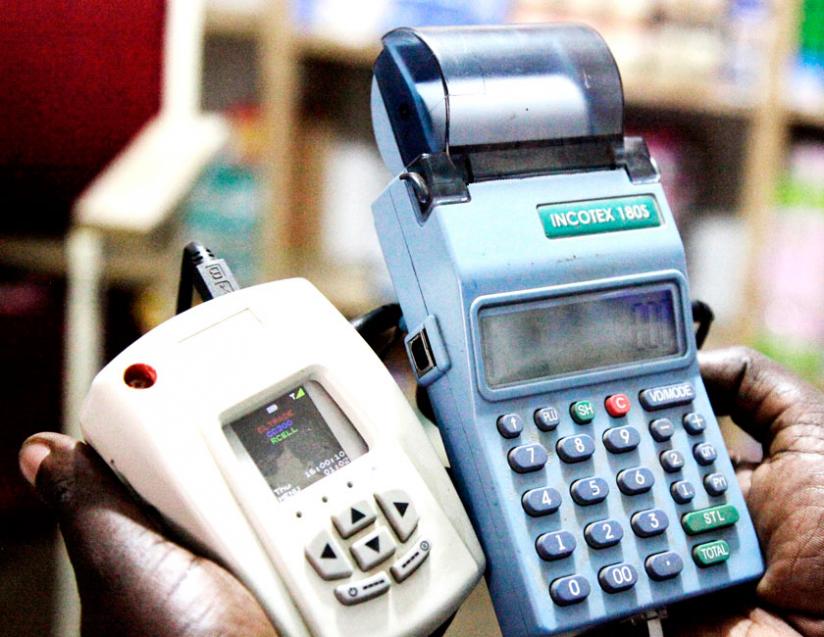 A trader displays an e-billing machine. EBMs are a must-have for all VAT-registered traders. (File)