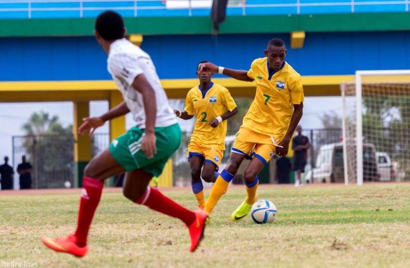 Jean Baptiste Mugiraneza (R), seen here in action in a past friendly game against Ethiopia, has tipped Amavubi to shine in CHAN. (File)