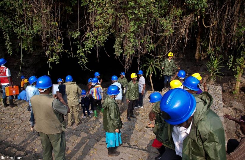Tourists are briefed before embarking on a cave tour in Musanze. (File)