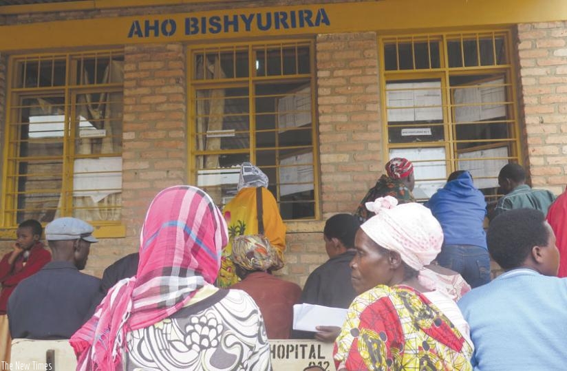 Patients pay for the services rendered to them at Kabutare Hospital on Thursday. (Emmanuel Ntirenganya)