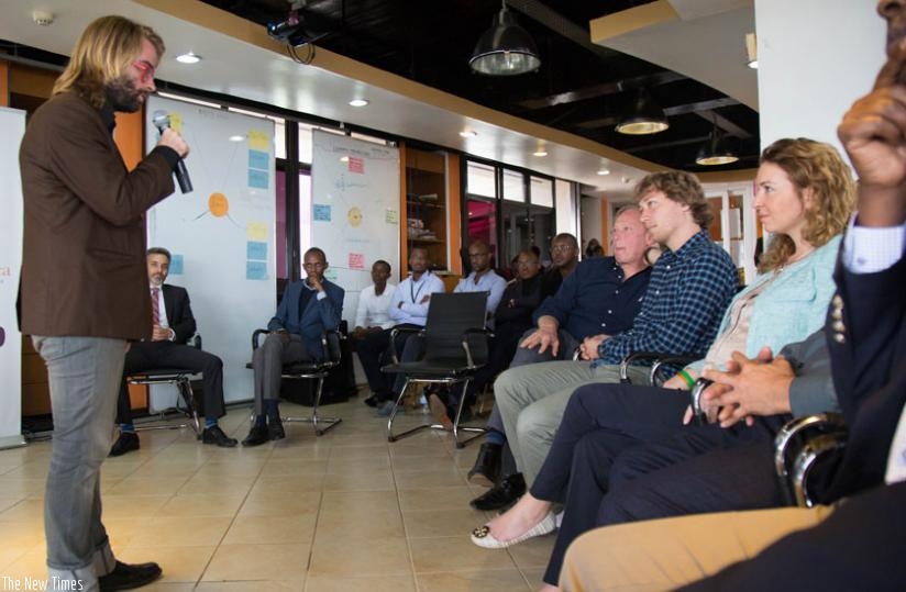 Barrett of 'SafeMotos' speaks to investors at K-Lab in Kigali yesterday. The entrepreneur is looking for $60,000 in a short-term debt. (Timothy Kisambira)