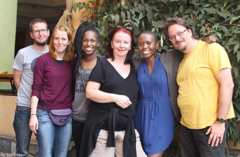 The Helios Theater team pauses with local actresses Dida Nibagwire (3rd left) and Eliane Umuhire (2nd right). (File)