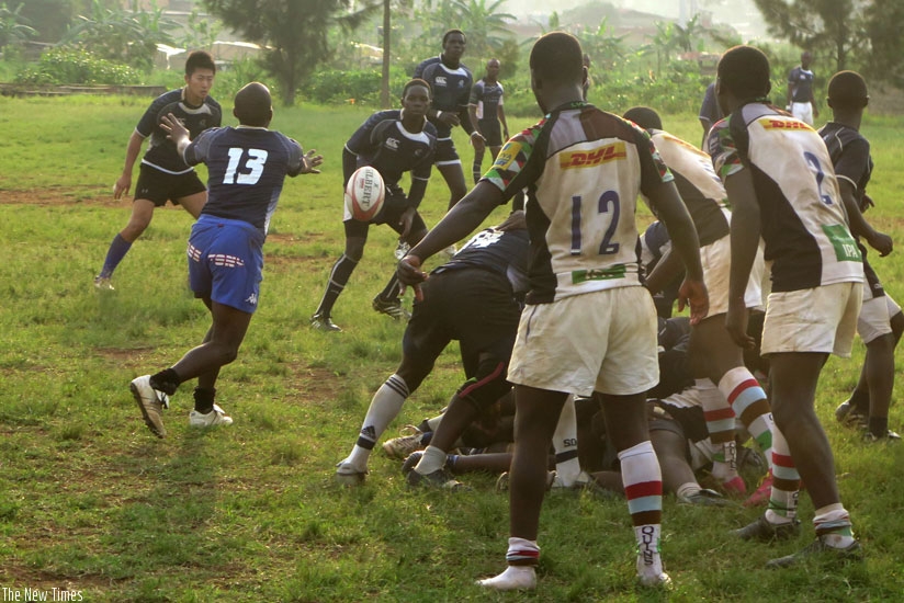 Thousand Hills scrum-half Serge Shema (#13) tries to pass the ball in the league game against Kigali Sharks last season. (Stephen Kalimba)
