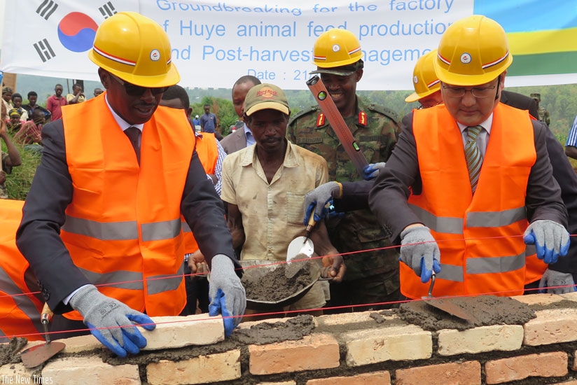 Munyantwali (L) and Amb. Park during the groundbreaking ceremony for construction of the Huye animal feeds production facility on Thursday. (Emmanuel Ntirenganya)