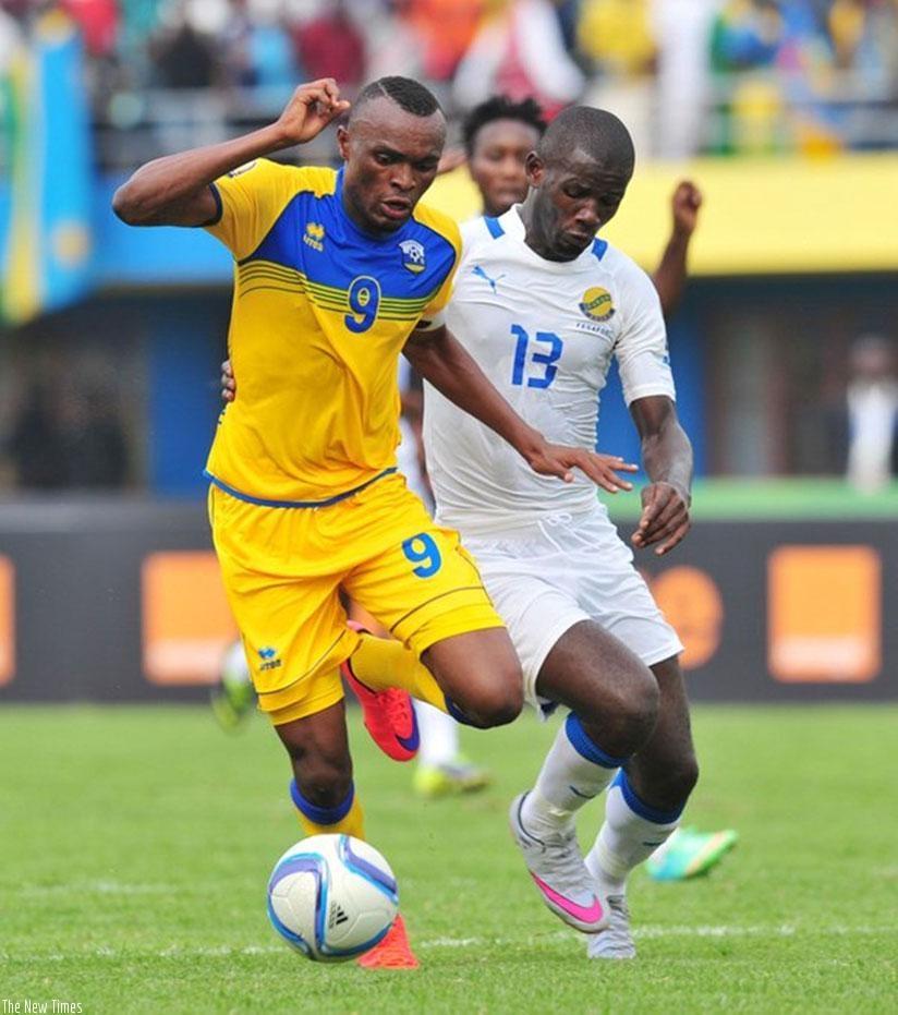 Amavubi captain Jacques Tuyisenge is tackled by Gabon midfielder Franck Obambou during last game. (Courtesy)