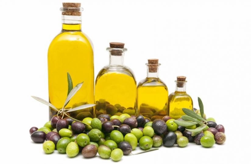 Bottle containing olive oil and olives where the oil is extracted from. (Net photo)