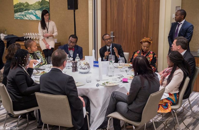 President Kagame and Elsie Kanza, Head of Africa and Member of Executive Committee at WEF (on his left), and President of AfDB, Akinwumi Adesina, with other delegates during the WEF in Davos last week. (Courtesy)