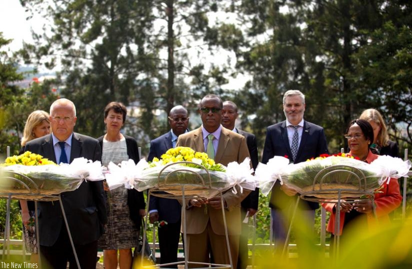 German Ambassador to Rwanda Peter Fahrenholtz (L), Jean Damascene Bizimana, the head of the National Commission for the Fight against Genocide (C), and Israeli Ambassador to Rwanda Belaynesh Zevadia (R) lay wreaths at Kigali Genocide Memorial Centre yesterday. (Timothy Kisambira)