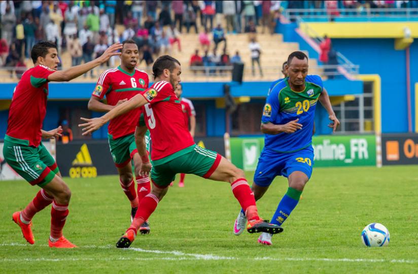 Hegman Ngomirakiza dribbles past three  Moroccan players. The midfielder scored in Amavubi's 1-4 defeat to the North Africans on Sunday. (T. Kisambira)