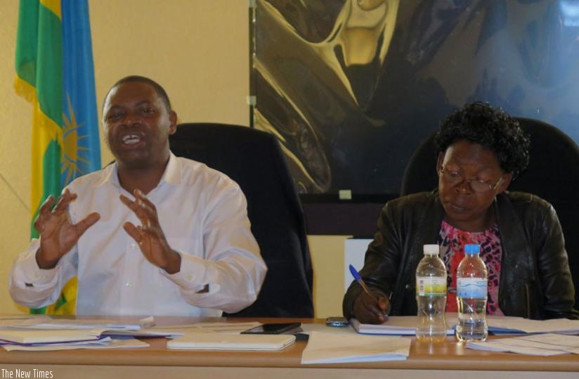 Dr Ndikumana (L) and the outgoing council's secretary Marthe Mukasine during the meeting last week. (Emmanuel Ntirenganya)