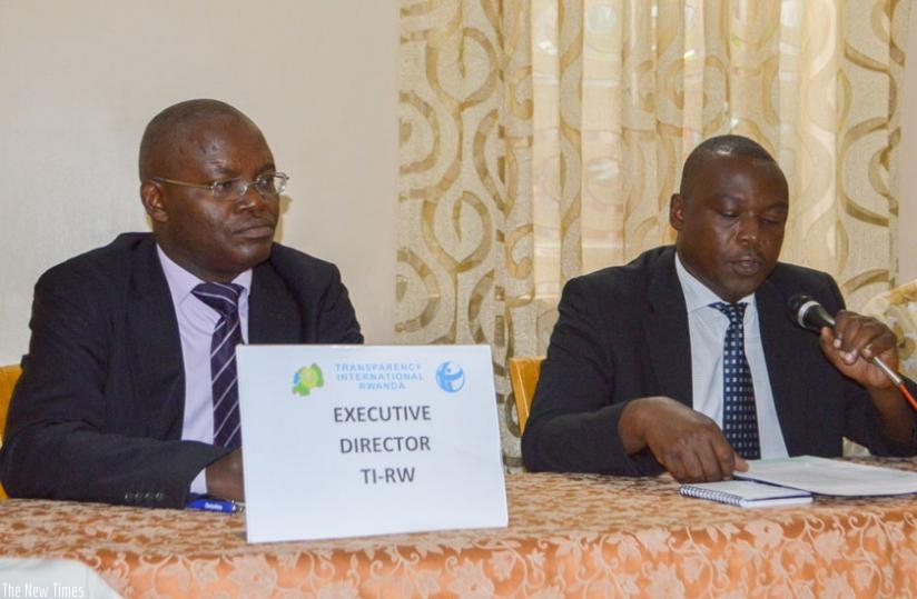 Mupiganyi  (L) and Musangabatware at the release of the report in Kigali yesterday. (Courtesy)