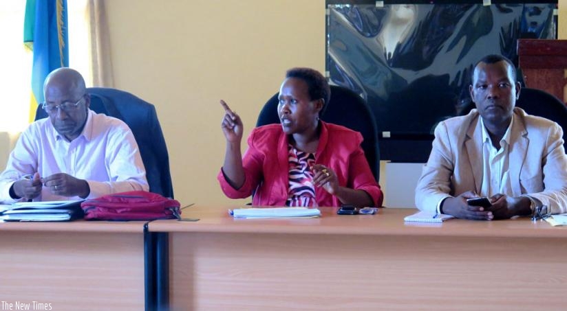 MP Jacqueline Mukakanyamugenge (C) speaks as MP Kayitare (L)  and Huye District Mayor, Eugene Kayiranga Muzuka look on during the MPs' presentation of findings on Tuesday. (Jean d'Amour Mbonyinshuti)