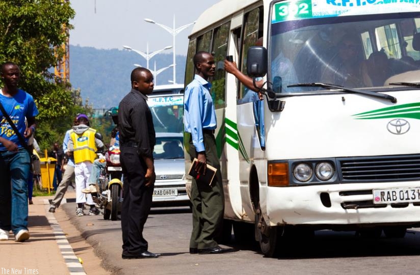 Passengers board an omnibus at a bus stage in Kimihurura, a city suburb. (File)