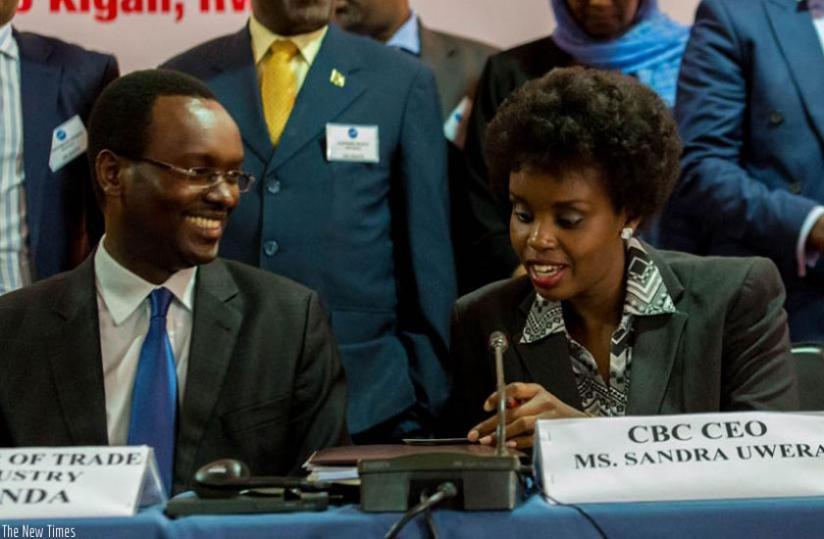 Sandra Uwera (right), the chief executive officer, COMESA Business Council, and Emmanuel Hategeka, the permanent secretary at Trade and Industry Ministry, chat during the Kigali meeting last week. (File)