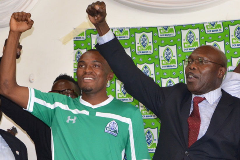 Tuyisenge and Gor Mahia's Chairman Ambrose Rachier at his unveiling at Nyayo National Stadium. (Courtesy)