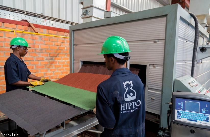 Workers monitor iron sheets at Hipo Factory. Some legal minds say the labour law  favours                        employees upon termination of fixed contracts. (File)